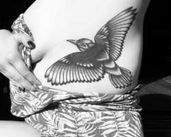 The star is a tattoo lover and has various tattoos on her body including a bird tattoo on her side rib.